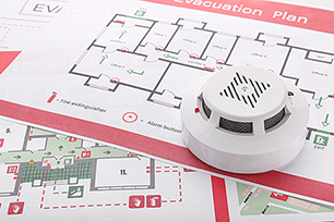 Fire alarm on top of a building evacuation plan